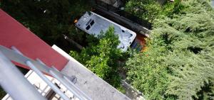 an overhead view of a white car parked on a street at Villa Panthera in Dramalj