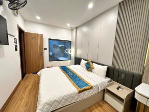 Postel nebo postele na pokoji v ubytování Phi Hùng Hotel