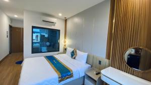 Postel nebo postele na pokoji v ubytování Phi Hùng Hotel