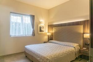 Voodi või voodid majutusasutuse Hotel Kuma toas