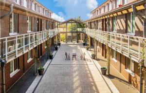 an empty hallway of an old building with two benches at Apt 3 Hohen Wieschendorf in Hohen Wieschendorf