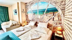 a bedroom with two beds in front of a window at Baltic Del Mar by Baltic Batavia-Widok na Morze in Świnoujście