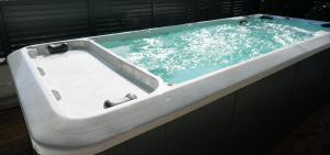 a bath tub with blue water in it at Villa Panthera in Dramalj +33 photos