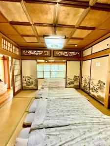 Voodi või voodid majutusasutuse T&T Fujiyama Guest House toas