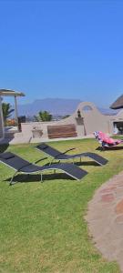 a park with a bunch of equipment in the grass at Luxury flat with magnificent views in Plattrkloof in Cape Town