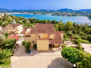 an aerial view of a house with a lake at Estasia Luxury Villa with private pool by DadoVillas in Kommeno +34 photos