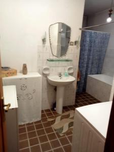 a bathroom with a sink and a mirror at CASA di PIERO in Monte San Pietrangeli