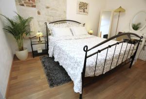 Posteľ alebo postele v izbe v ubytovaní Apartment ARCHIE