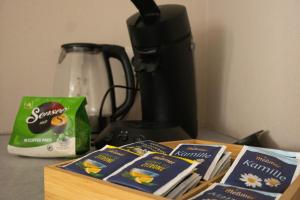 two packages of food sitting on a counter next to a blender at Kuzey Apartments in Kappel-Grafenhausen