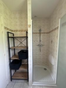 a shower stall in a bathroom with a shower at Maison d'architecte in Cébazat +11 photos