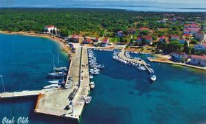 an aerial view of a marina with boats in the water at Vila Klara in Olib