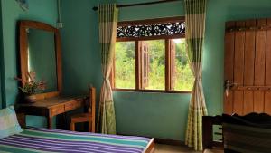 Postel nebo postele na pokoji v ubytování Thomasha Homestay Wellawaya