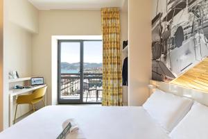Кровать или кровати в номере B&B Hotel Savona