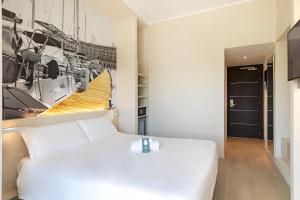 Кровать или кровати в номере B&B Hotel Savona