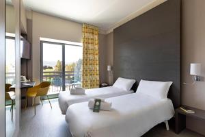 Кровать или кровати в номере B&B Hotel Savona