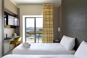 Кровать или кровати в номере B&B Hotel Savona