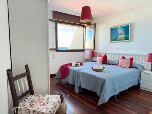 a bedroom with two beds and a window at Mar adentro - 5607 in Isla