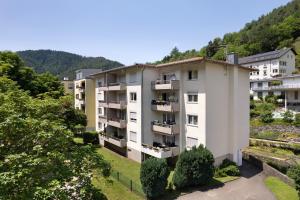an apartment building with balconies and trees at Lopezan home and living in Hornberg