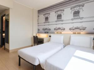 Postel nebo postele na pokoji v ubytování B&B Hotel Faenza