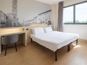 Postel nebo postele na pokoji v ubytování B&B Hotel Faenza