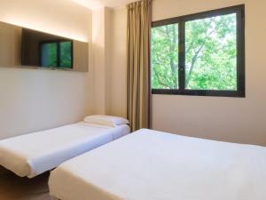Postel nebo postele na pokoji v ubytování B&B Hotel Faenza
