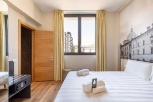 Postel nebo postele na pokoji v ubytování B&B Hotel Brescia