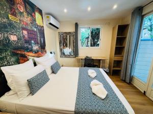 Postel nebo postele na pokoji v ubytování Hôtel Coco Island