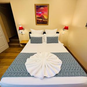 Postel nebo postele na pokoji v ubytování Hôtel Coco Island