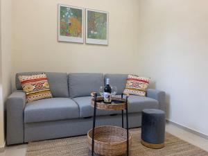 a living room with a couch and a table at La Primavera Apartment in Ercolano
