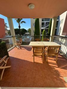 a patio with a table and chairs on a balcony at Antibes Port - Terrasse - Parking - Piscine in Antibes +20 photos