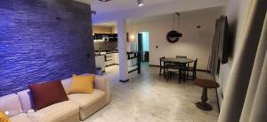 a living room with a couch and a table at Complejo las Catalinas Dto 2 A in Puerto Madryn