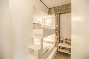 a room with two bunk beds in it at Convent-Βand Αpartment in Kalabaka +27 photos