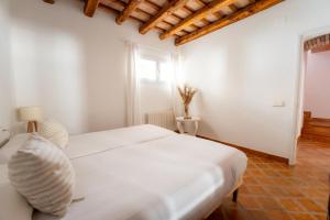 Posteľ alebo postele v izbe v ubytovaní Deco - Casa Voltes Peratallada