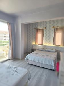 Postel nebo postele na pokoji v ubytování Diamant Otel + 37 fotografií