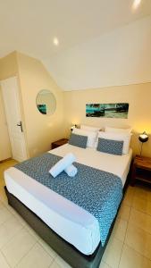Postel nebo postele na pokoji v ubytování Hôtel Coco Island