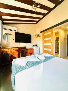 Postel nebo postele na pokoji v ubytování Hôtel Coco Island