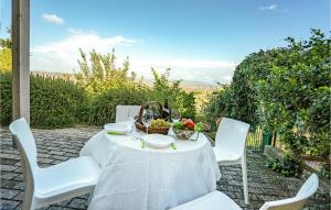 a white table with a bowl of fruit on it at Beautiful Home In Lajatico -Pi- in Laiatico