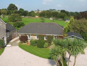 an aerial view of a house with a garden at Bow Cottage in Paignton