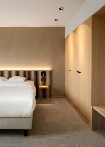 Postel nebo postele na pokoji v ubytování Hotel Chamade