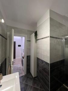 a bathroom with a shower and a sink and a toilet at Gold Vollga House Durres in Durrës