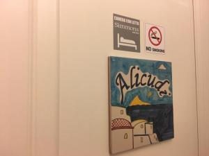 a sign on a door with a painting on it at Casa Mafalda B&B in Lipari