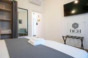 Postel nebo postele na pokoji v ubytování DOMINA Guest House