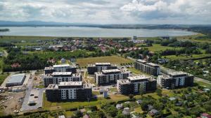 an aerial view of a city with buildings and a lake at Nyskie Ustronie in Nysa