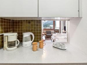 Kuchyň nebo kuchyňský kout v ubytování Apartment Guardaval - Utoring-1 by Interhome