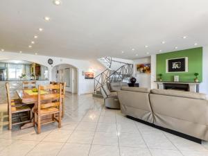 a kitchen and living room with a table and chairs at Holiday Home Llobregat 41b by Interhome in Empuriabrava