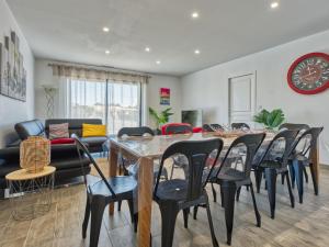 a dining room with a table and chairs at Villa Les Alyzés by Interhome in Vensac