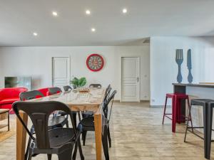 a dining room with a table and chairs at Villa Les Alyzés by Interhome in Vensac +20 photos