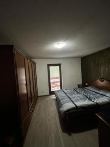 Postel nebo postele na pokoji v ubytování Kuky's Val di Sole Retreat