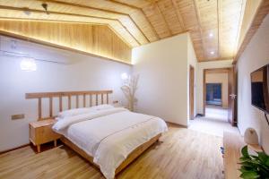 Hongfu Villa - Zhangjiajie National Forest Park West Gate客房内的一张或多张床位