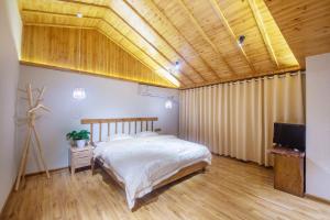 Hongfu Villa - Zhangjiajie National Forest Park West Gate客房内的一张或多张床位